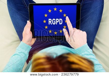 Woman Using A Touch Pad With Flag Of European Union With Rgpd Word Inside On The Screen