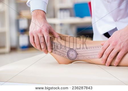 Doctor checking patients joint flexibility