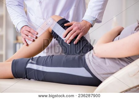 Doctor checking patients joint flexibility