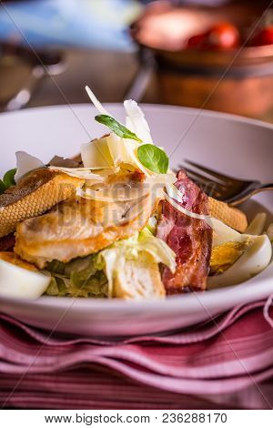 Caesar Salad With Egg Lettuce Bacon Crutons Grill Chicken Breast And Parmesan Cheese