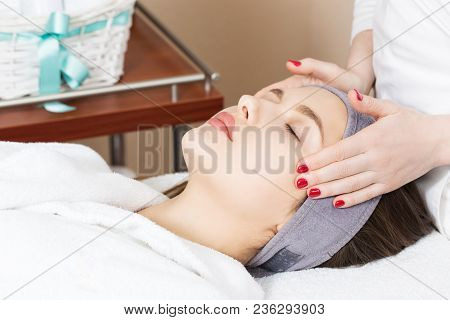 Facial Massage For A Beautiful Girl In A Spa Salon