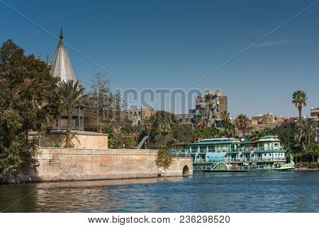 Cairo, Egypt February 11 2012: The Nileometer And Tourist Sailing Boat On The River Nile In The Midd