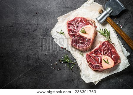 Raw Beef Steak Osso Bucco On Black Stone Slate Background. Marble Meat. Top View With Copy Space.