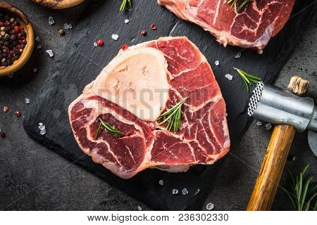 Raw Beef Steak Osso Bucco On Black Stone Slate Background. Marble Meat. Top View With.