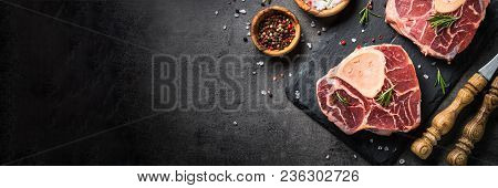 Raw Beef Steak Osso Bucco On Black Stone Slate Background. Marble Meat. Top View With Copy Space. Lo