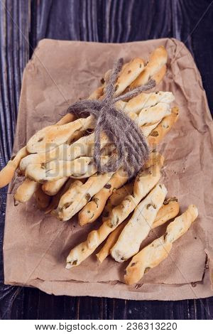 Crispy Grisini With Olive On Old Brown Paper In Studio