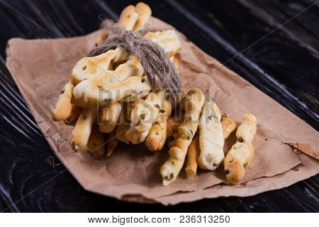 Crispy Grisini With Olive On Old Brown Paper In Studio
