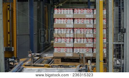 Moscow, Russia - May, 2017: Packed Box On Production Line. Clip. Cardboard Boxes On Conveyor Belt In