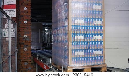Moscow, Russia - May, 2017: Packed Box On Production Line. Clip. Cardboard Boxes On Conveyor Belt In