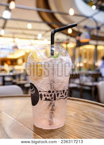Cold Drink Of Lychee Lamon Juices With Soda And Ice On The Table In The Restaurant (seclective Focus