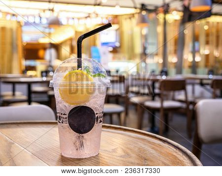 Cold Drink Of Lychee Lamon Juices With Soda And Ice On The Table In The Restaurant (seclective Focus