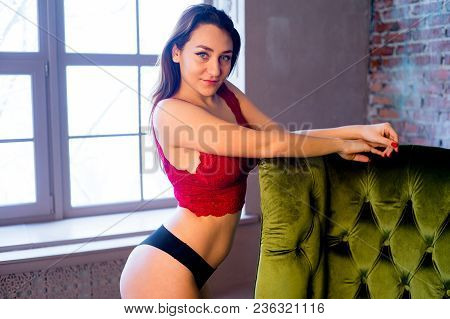 A Portrait Of A Beauriful Woman In A Lingerie