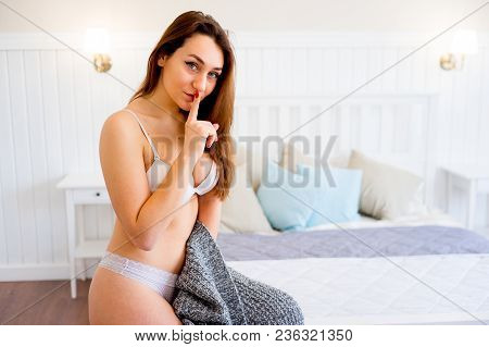 A Portrait Of A Beauriful Woman In A Lingerie