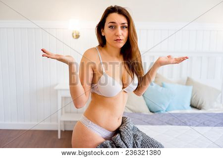 A Portrait Of A Beauriful Woman In A Lingerie