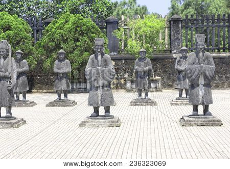 Stone statues of people in Imperial Minh Mang Tomb of the Nguygen dynasty in Hue, Vietnam. UNESCO world heritage site