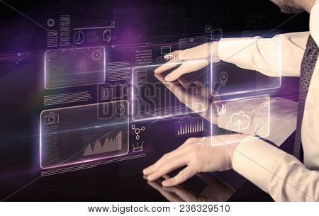 Male hands touching interactive table with purple cloudspace graphic on it 