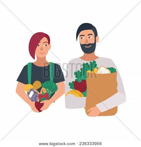 Portrait Of Pair Of Freegan Man And Woman Holding Fruits, Vegetables And Other Products. Young Coupl