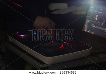 Dj Mixing Music On Console At The Night Club. Hand On A Sound Mixer Station. Mixer Equipment Enterta