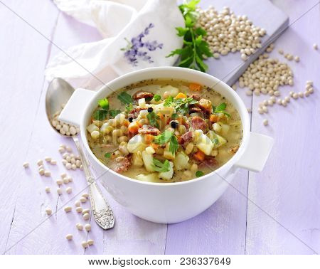 Minestrone Vegetable Soup With Soybean Protein Sprinkled With Fresh Lovage.