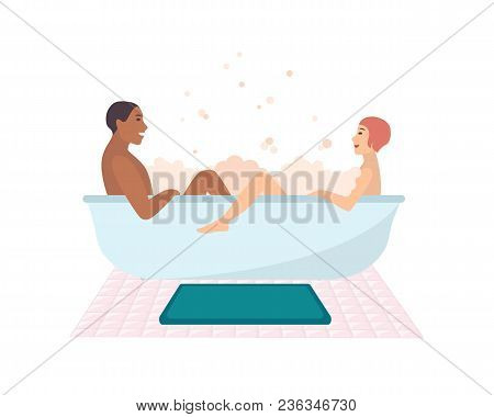 Young Naked Couple Sitting In Bathtub Full Of Soap Foam Isolated On White Background. Happy Smiling 