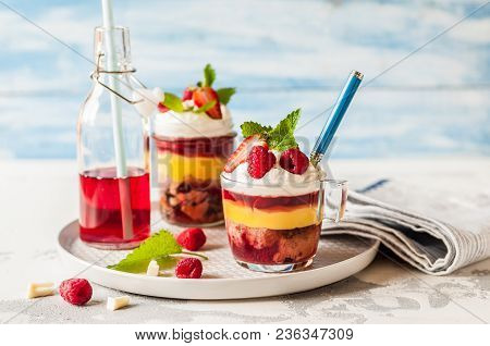 Fruit Cake, Jelly, Custard, Berry And White Cocolate Whipped Cream Individual Trifles, Copy Space Fo