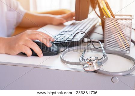 Healthcare And Medical Concept, Doctor's Working Seaching Information About Patient Database Through