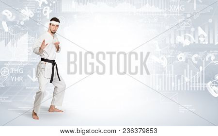 Young karate trainer doing karate tricks on the top of a metropolitan city