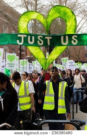 London, United Kingdom, 14th April 2018:- Marchers On A Silent March From Kensington Town Hall To Th