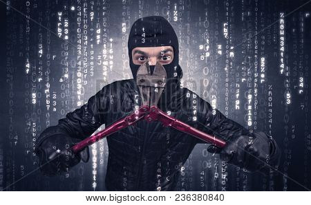 Burglar in action with encoded concept and his tools in his hand. 