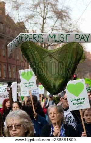 London, United Kingdom, 14th April 2018:- Marchers On A Silent March From Kensington Town Hall To Th