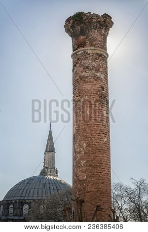 An Old Brick Column Or Mineret Near To A Mosque In Istanbul, Turkey.