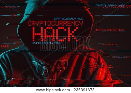 Cryptocurrency Hack Concept With Faceless Hooded Male Person, Low Key Red And Blue Lit Image And Dig