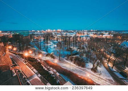 Tallinn, Estonia. Old Stone Staircase And Cityscape At Winter Evening Night. View From Patkuli Viewp