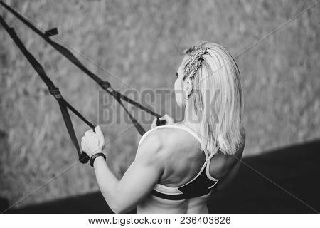 Beautiful Woman Is Doing Exercises In The Sport Club.