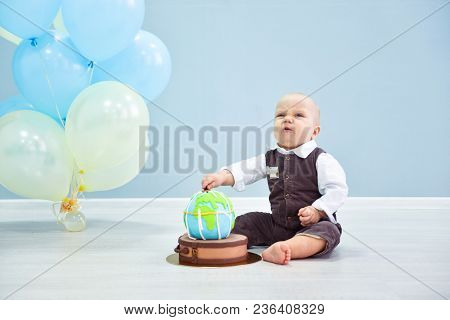 First Birthday For The Boy. Smash The Cake, A Thematic Birthday - A Travel, Trip. Globe. Researcher