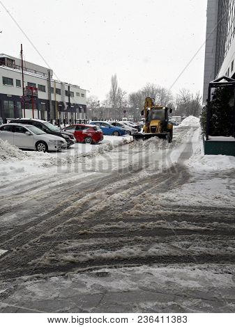 Bucharest, Romania - February 18: Bulldozer Cleaning Road After Snowstorm In Bucharest, Romania, Win