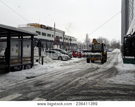 Bucharest, Romania - February 18: Bulldozer Cleaning Road After Snowstorm In Bucharest, Romania, Win