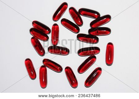 Black Cumin Oil. Black Cumin Oil Capsules Isolated On White Background. Medical Black Cumin.