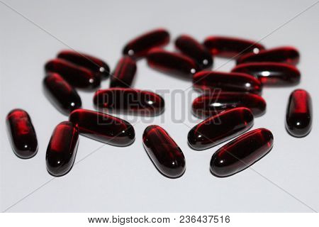 Black Cumin Oil. Black Cumin Oil Capsules Isolated On White Background. Medical Black Cumin.