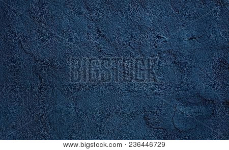 Beautiful Abstract Grunge Decorative Relief Navy Blue Background. Rough Stylized Plaster Wall Textur