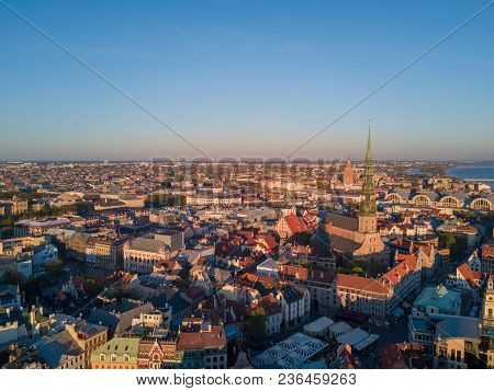 Sunset View Over The Old Town Of Riga - Vecriga With Golden Rooster In The Foreground