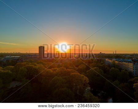 Amazing Aerial Sunset View Over Riga City In Latvia. Statue Of Liberty In The Middle Of The City - M