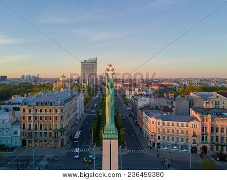 Beautiful Sunset View In Riga By The Statue Of Liberty - Milda.