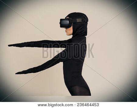 Vr Posing And Showing Off Of A Woman In Black Suit. Experiencing The Virtual Reality Helmet. Hi-tech