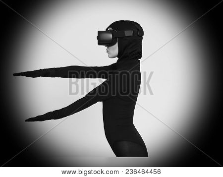 Vr Posing And Showing Off Of A Woman In Black Suit. Experiencing The Virtual Reality Helmet. Hi-tech