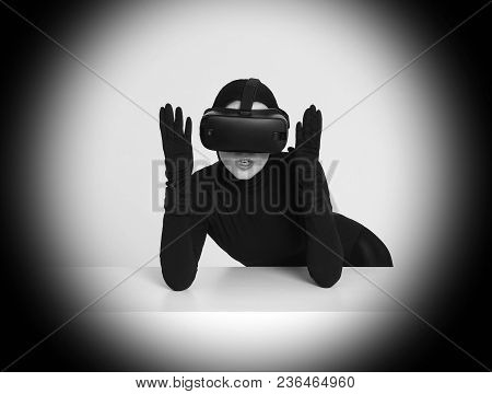 A Girl In A Black Suit Wears Vr Headset To Experience The New Technoligies Of Vitrual Reality. Hi-te