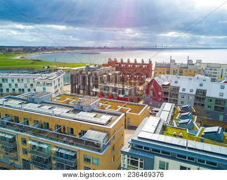Aerial Malmo City View From Above With Harbour, Turning Torso And The Bridge On The Horizon