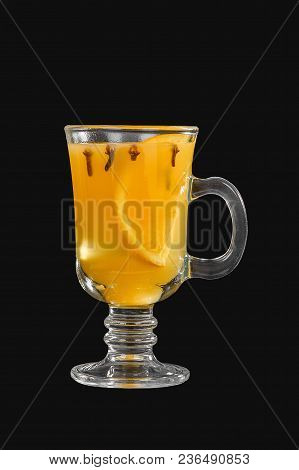 One-color Opaque Cocktail, Yellow Mulled Wine In A High Glass With A Handle With Spices And A Slice 
