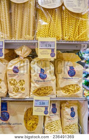 ROME, ITALY - CIRCA NOVEMBER 2017: shelves of pasta in Carrefour Express store in Rome. Carrefour Express is a convenience store chain owned and operated by French retailer Carrefour.
