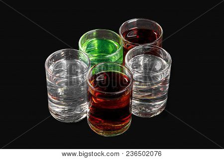 Multicolored Transparent Cocktails, A Set Of Shots In A Heap, A Wedge, Five Servings. Side View From